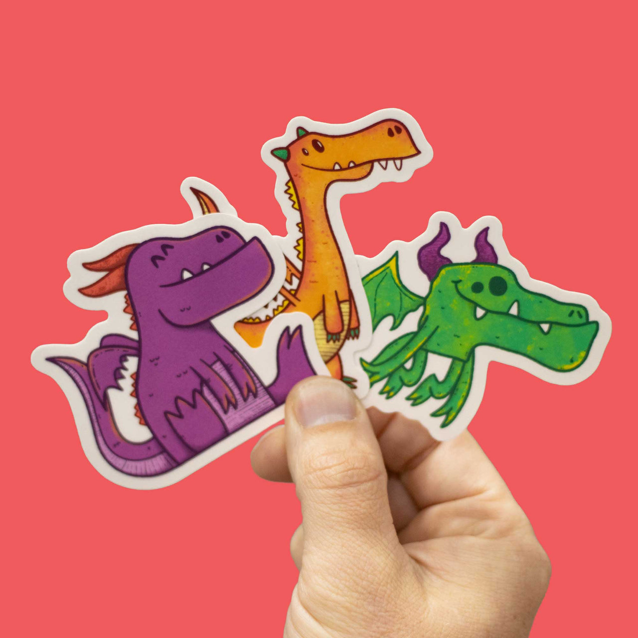 3 dragon stickers in hand