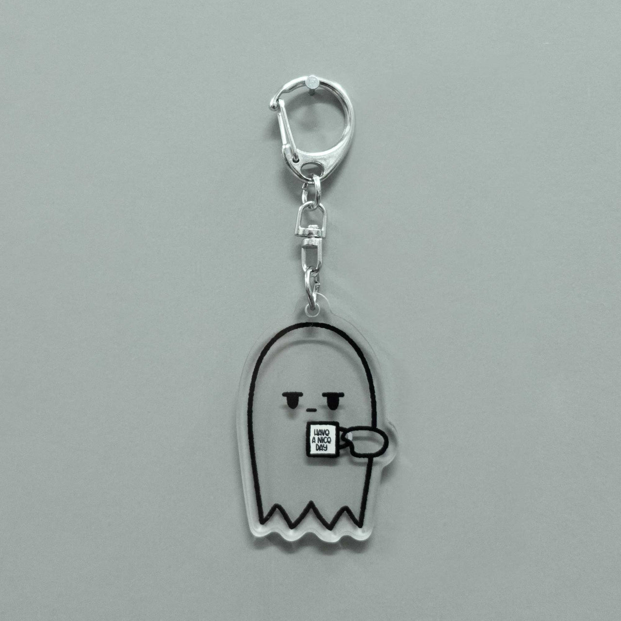 grumpy ghost transparent keychain holding coffee cup that says "have a nice day"