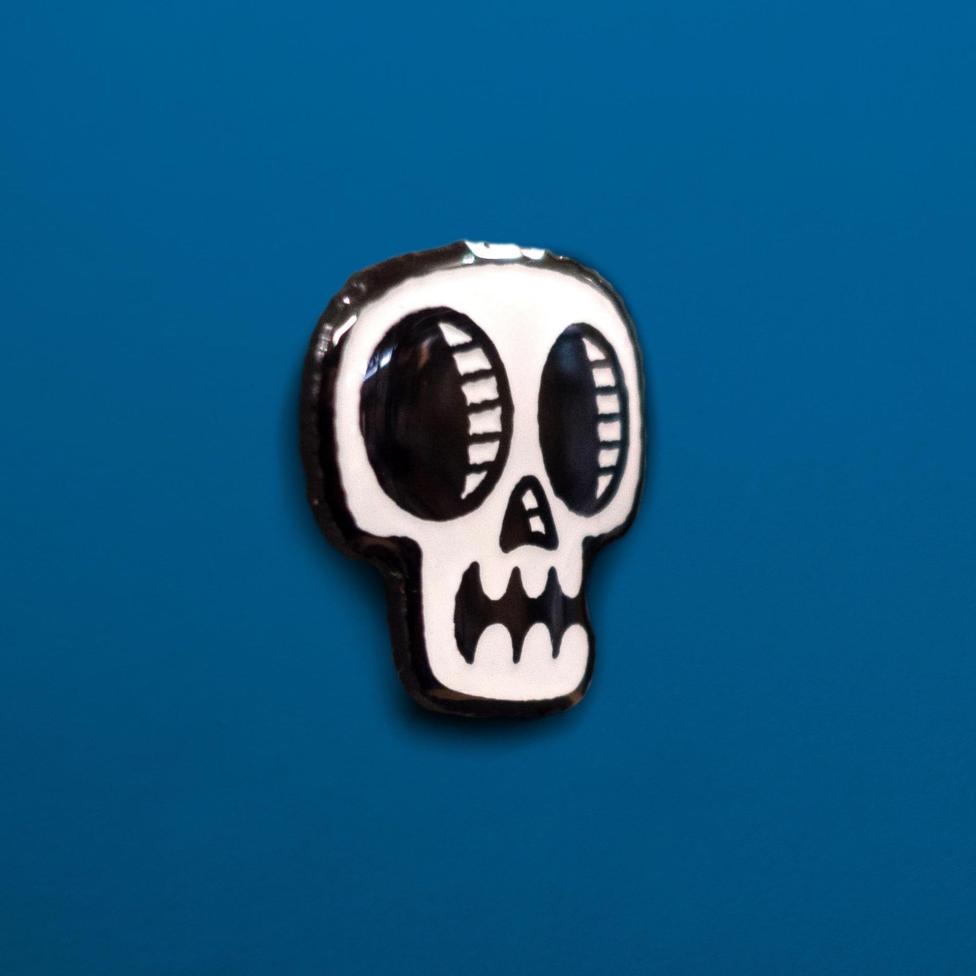 glow in the dark skull enamel pin